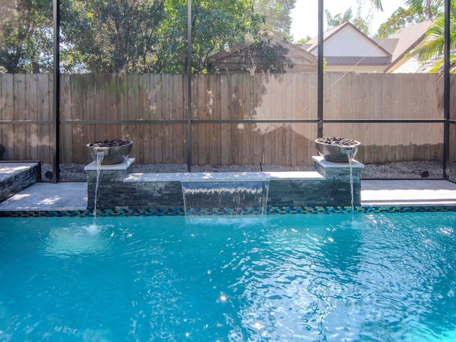 view of swimming pool featuring pool water feature