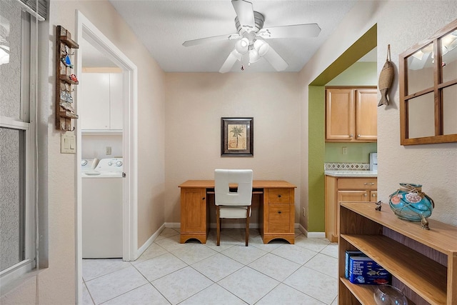 tiled office with ceiling fan and washer and dryer