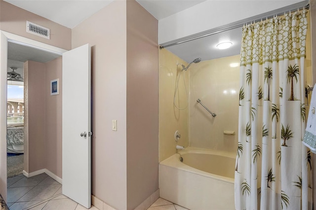 bathroom with tile patterned flooring and shower / tub combo