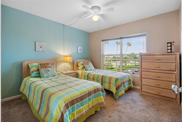 bedroom featuring ceiling fan and carpet