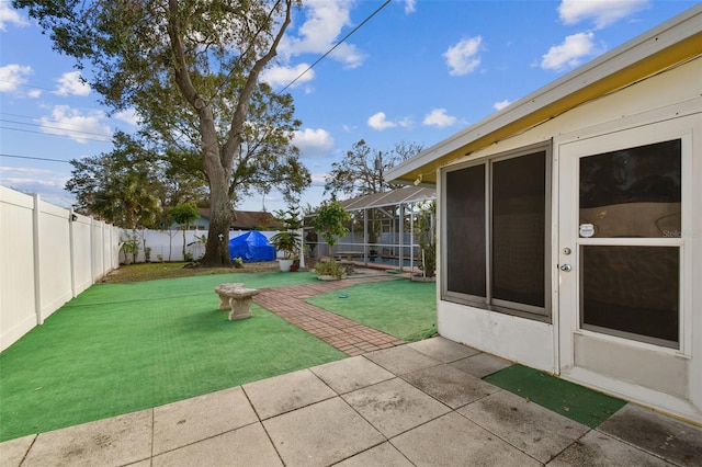 view of yard featuring a lanai and a patio