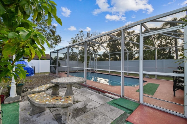 view of patio / terrace featuring a lanai and a fenced in pool