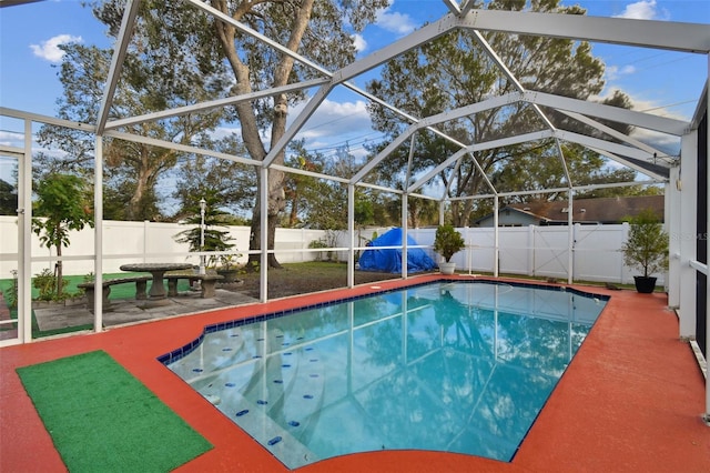 view of pool with a patio and a lanai