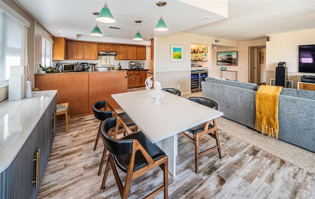 dining space featuring light wood-type flooring