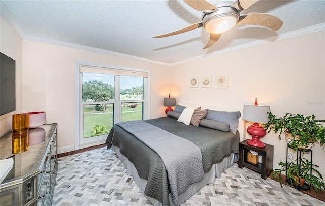 bedroom featuring a textured ceiling, ceiling fan, and crown molding