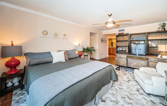 tiled bedroom with a textured ceiling, ceiling fan, and crown molding