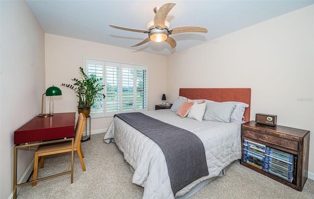 bedroom featuring light colored carpet and ceiling fan