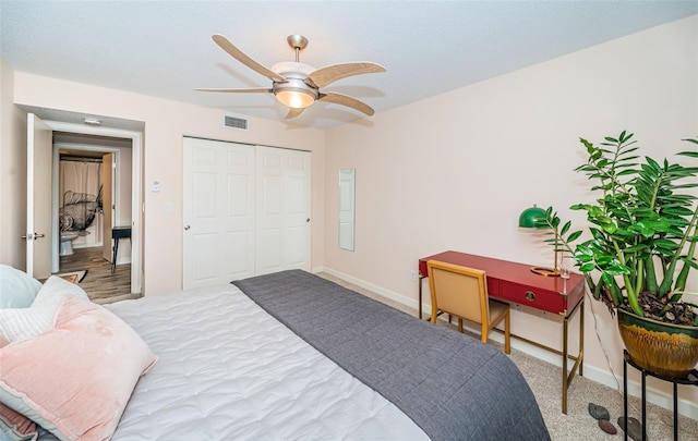 bedroom with ceiling fan and a closet