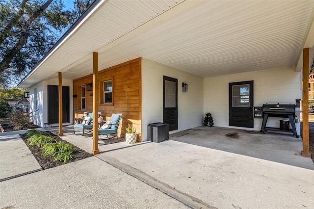 doorway to property featuring a patio area