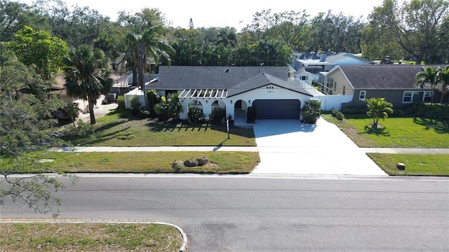 view of front facade featuring a front yard and a garage