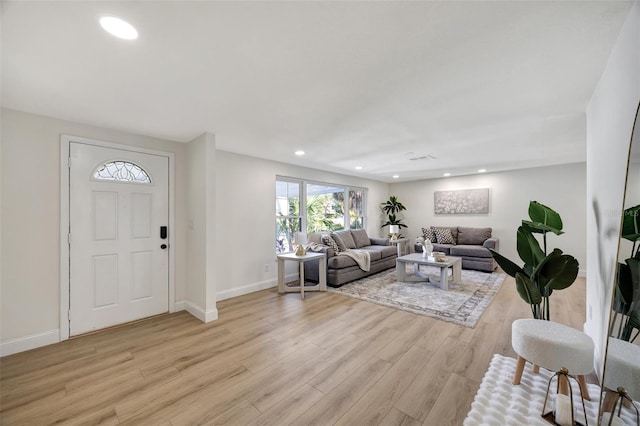 living room with light hardwood / wood-style flooring