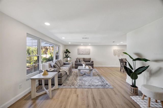 living room with light hardwood / wood-style flooring