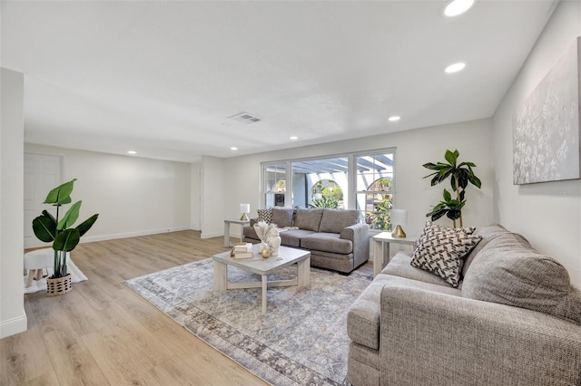 living room with light hardwood / wood-style floors