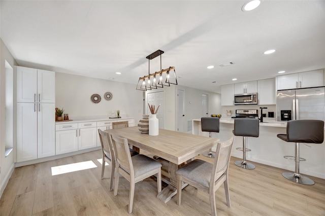 dining room with light wood-type flooring