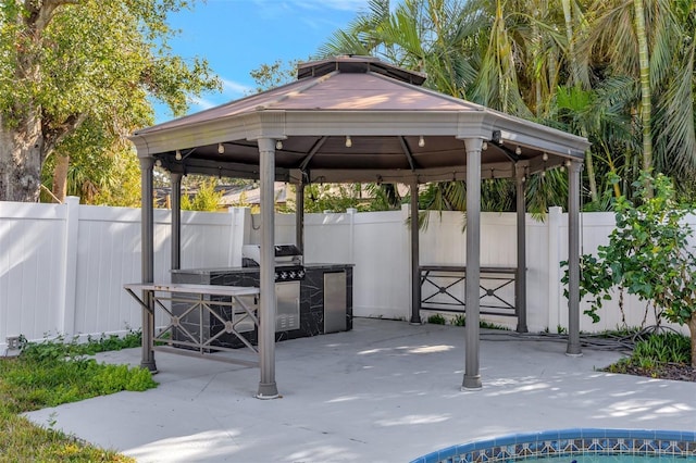 view of patio / terrace featuring area for grilling and a gazebo