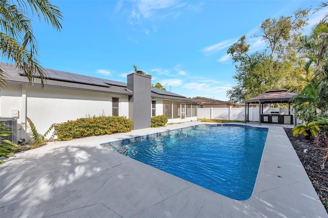 view of swimming pool with a gazebo, a patio area, and cooling unit