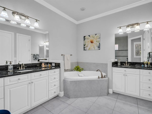 bathroom with tile patterned flooring, vanity, a relaxing tiled tub, and ornamental molding