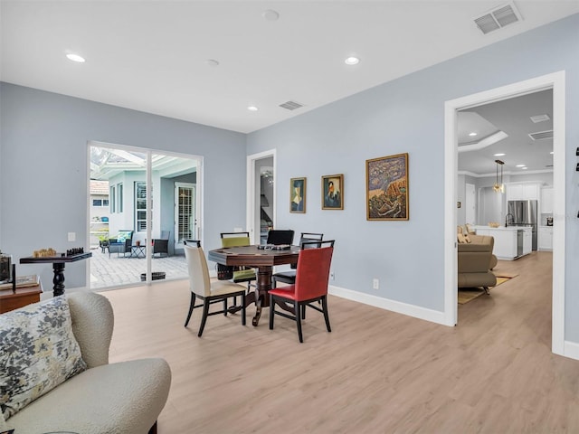 dining area with light hardwood / wood-style floors