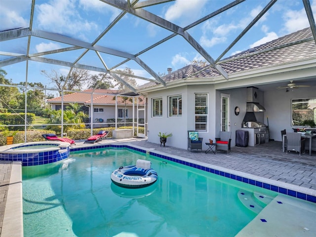 view of pool with an in ground hot tub, a lanai, a patio, ceiling fan, and grilling area