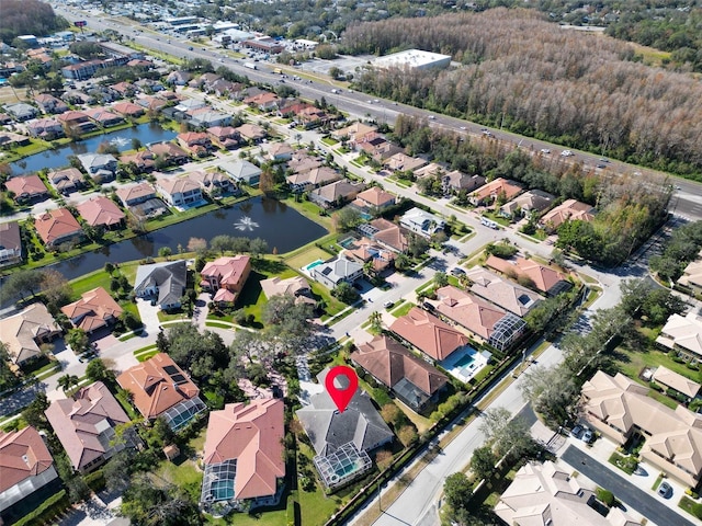 drone / aerial view with a water view