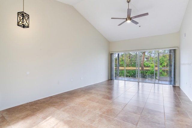 tiled spare room featuring ceiling fan and lofted ceiling