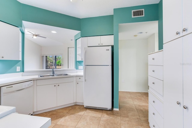 kitchen featuring ceiling fan, white appliances, light tile patterned flooring, white cabinets, and sink