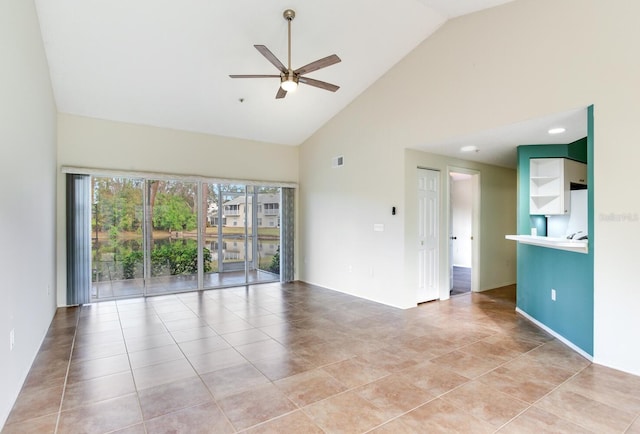 unfurnished room featuring ceiling fan, light tile patterned floors, and high vaulted ceiling