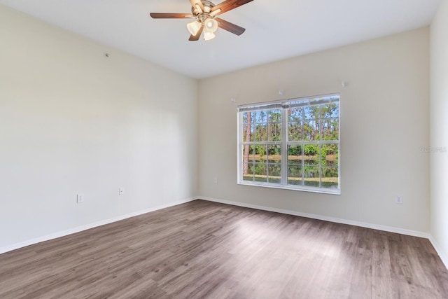 unfurnished room featuring ceiling fan and hardwood / wood-style floors