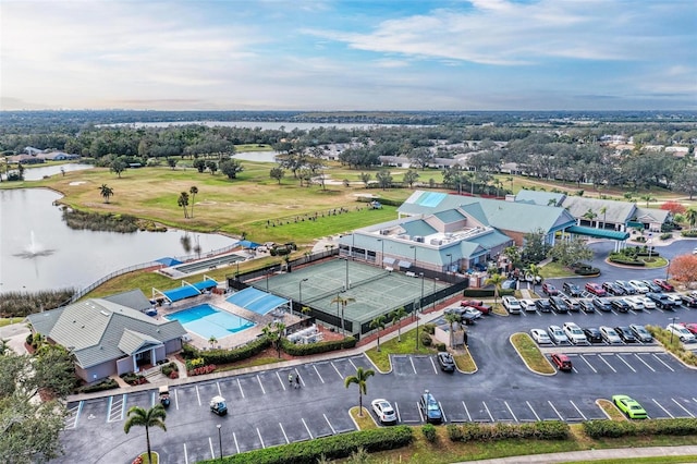 birds eye view of property with a water view