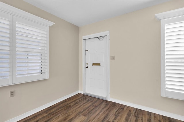 foyer with dark hardwood / wood-style floors