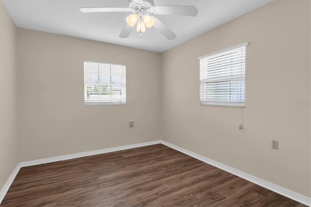 unfurnished room with ceiling fan, plenty of natural light, and dark hardwood / wood-style flooring