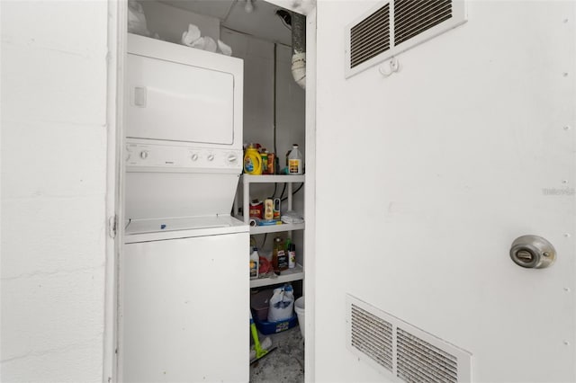 laundry area featuring stacked washer and dryer