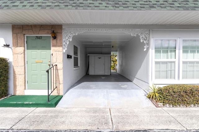 doorway to property with a carport