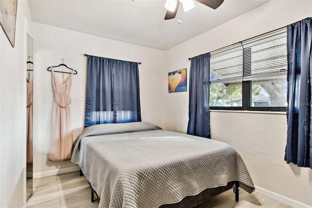 bedroom featuring ceiling fan and light wood-type flooring