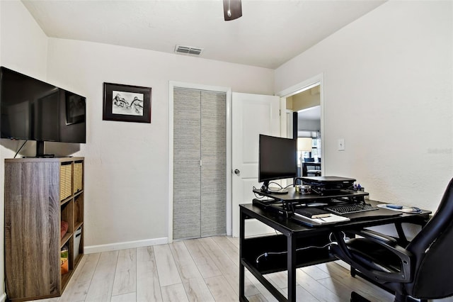 office with light hardwood / wood-style flooring