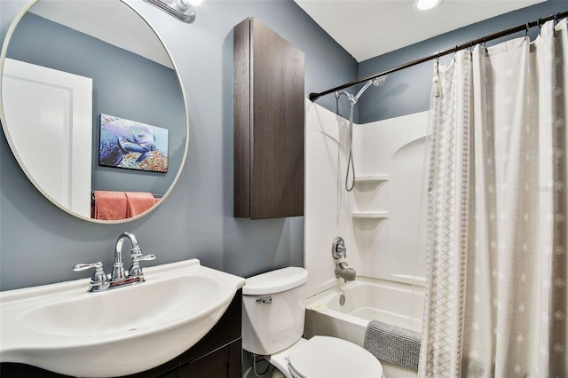 full bathroom with sink, shower / bath combo with shower curtain, and toilet