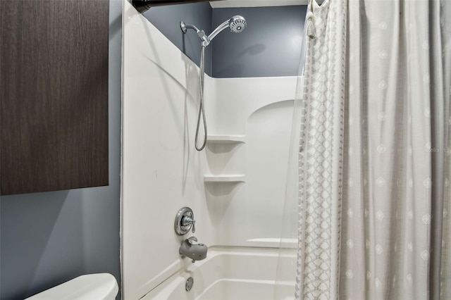 bathroom with shower / bathtub combination with curtain