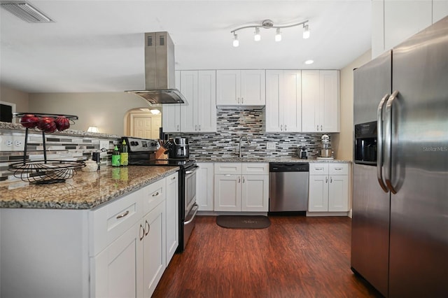 kitchen featuring stainless steel appliances, white cabinets, island range hood, and sink