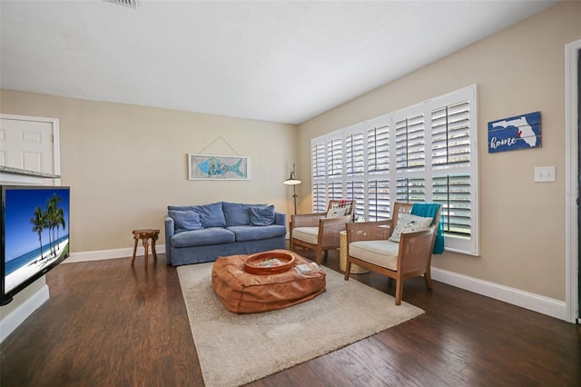 living room featuring dark hardwood / wood-style flooring