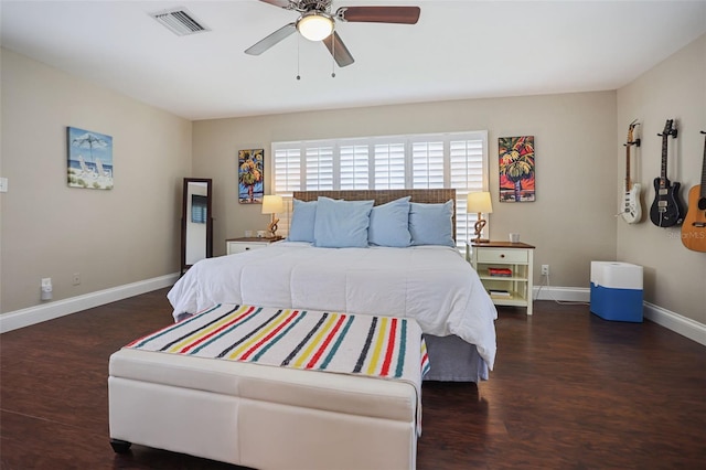 bedroom with ceiling fan and dark wood-type flooring