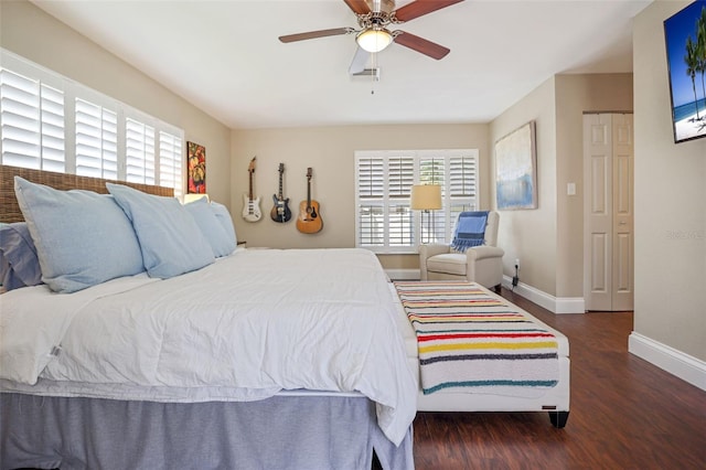 bedroom featuring ceiling fan, a closet, and dark hardwood / wood-style floors