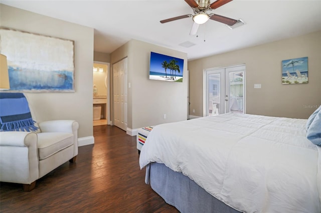 bedroom with dark wood-type flooring, french doors, ceiling fan, and connected bathroom