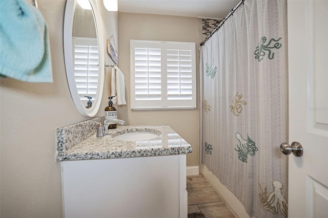 bathroom featuring vanity and walk in shower