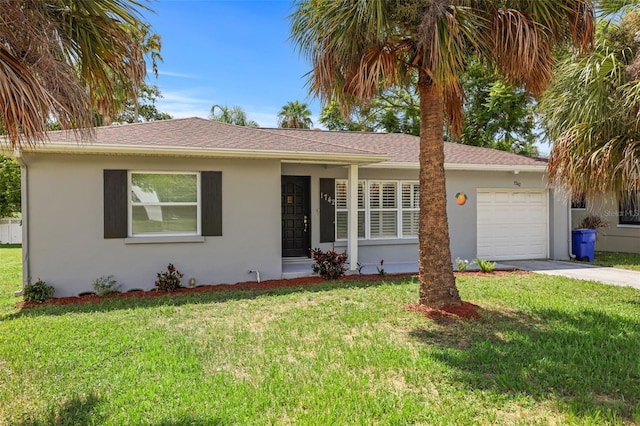 single story home featuring a front yard and a garage