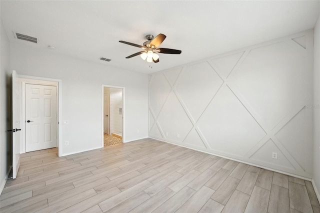 unfurnished room featuring ceiling fan and light hardwood / wood-style floors