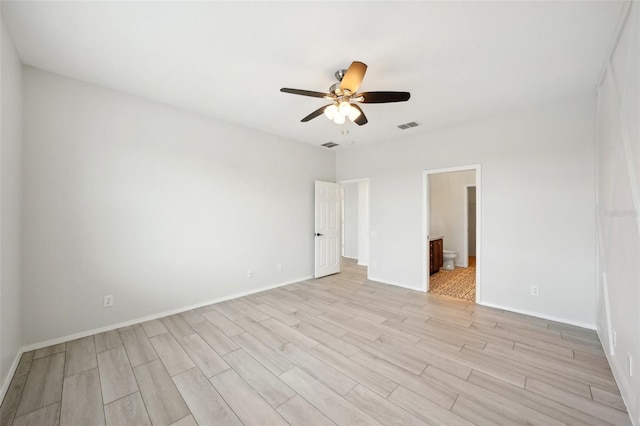 empty room featuring ceiling fan and light wood-type flooring