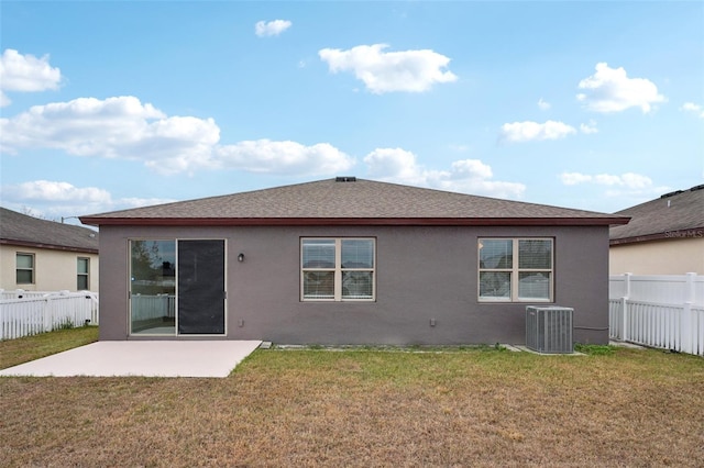 back of property featuring a yard, a patio area, and central AC unit