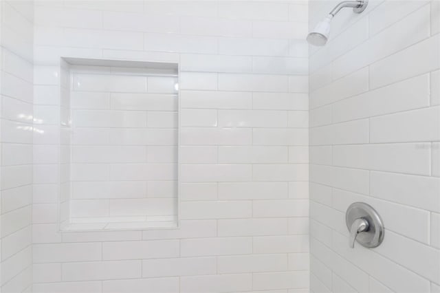 room details with a tile shower