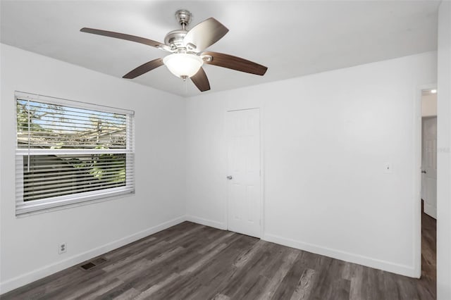 interior space with ceiling fan and dark wood-type flooring