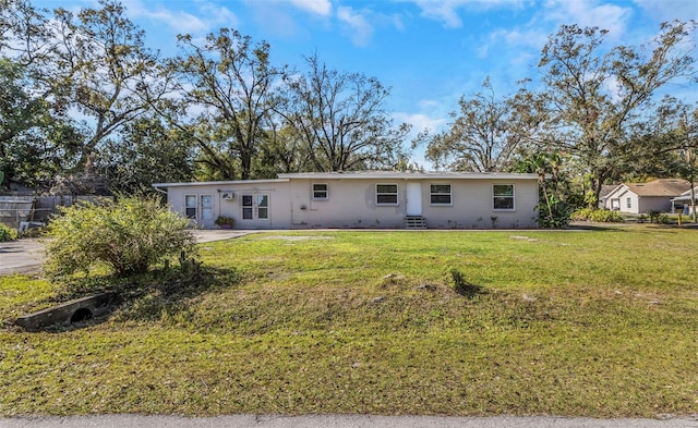 back of property with a yard